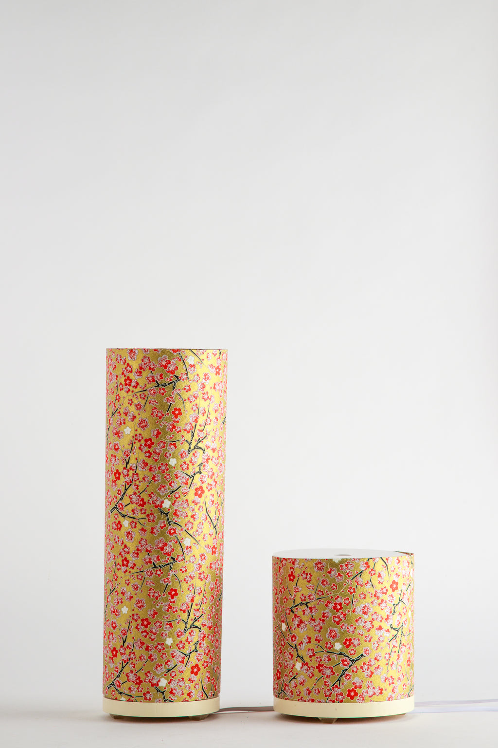 Tall and short cylindrical Japanese cherry blossom custom artistic bedside lamps with red floral branch pattern on golden paper, made by Branstead Design
