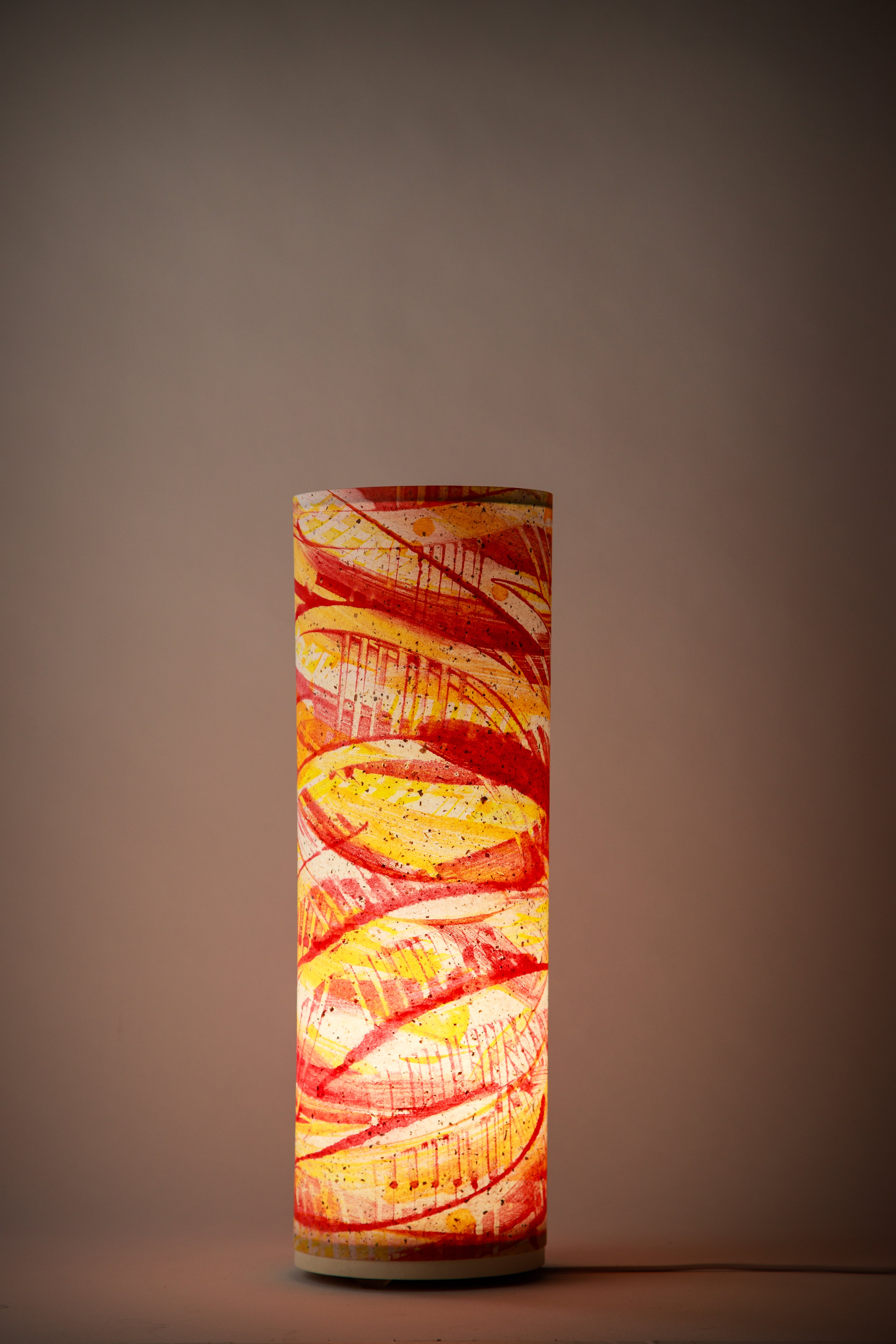 Flux Ember Spiral bedroom lamp glowing in a darkened room, showcasing dramatic red and amber tones with expressive spiral brushwork. Painted by Patricia Branstead.
