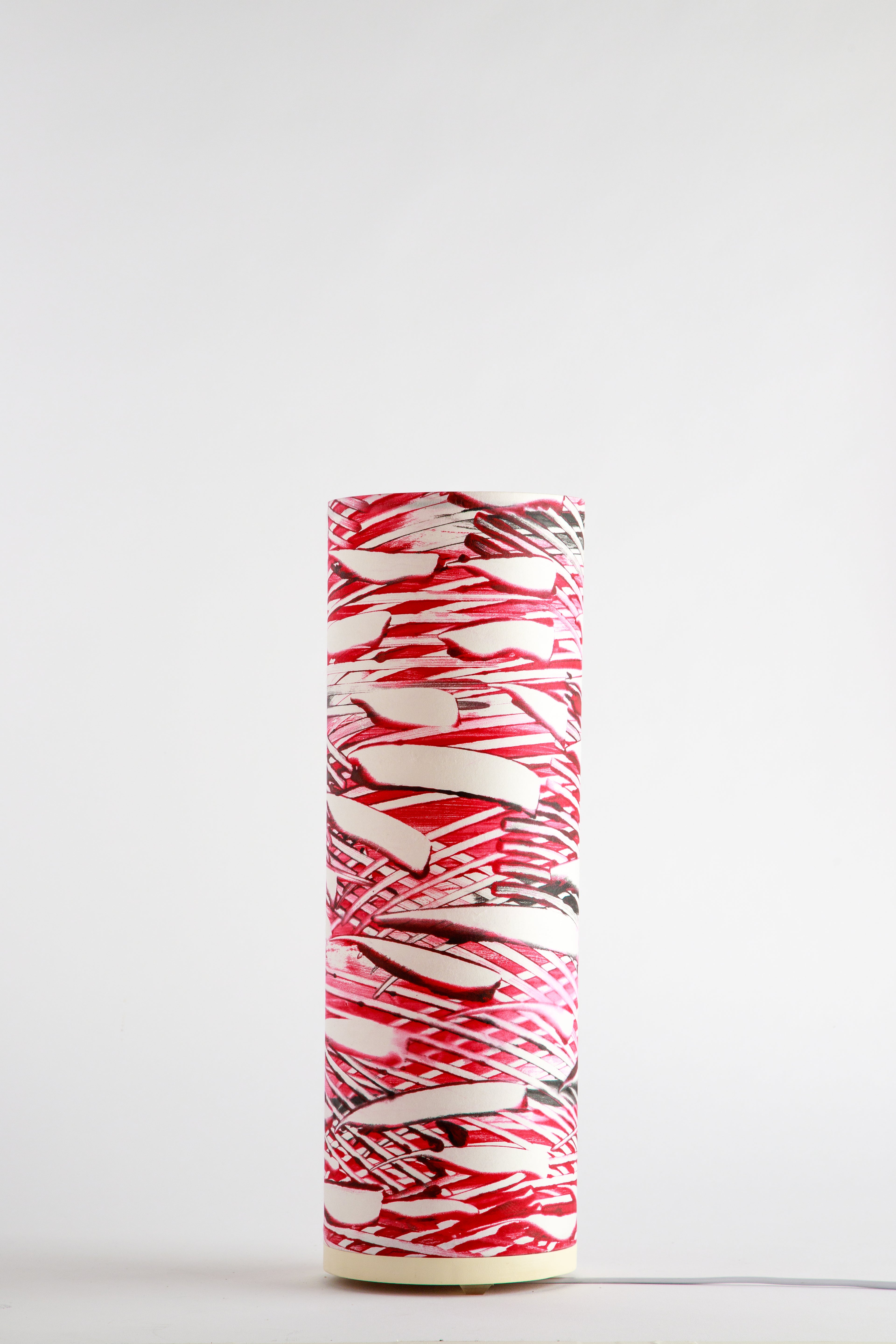 Strata – Crimson Samurai canvas cool table lamp by Patricia Branstead with bold red brush strokes and layered linear pattern, unlit on a white background.