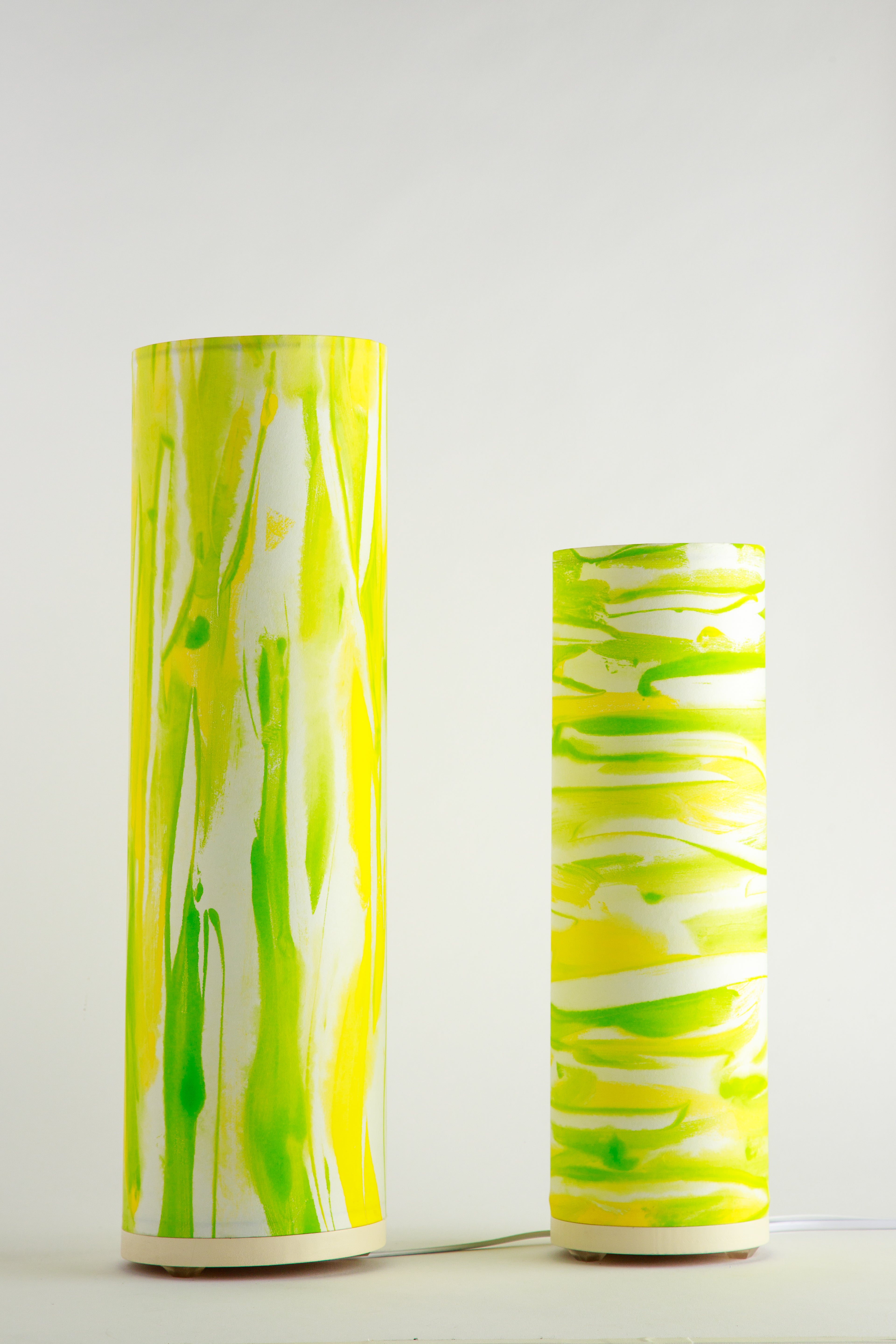 Handcrafted modern table lamp by Patricia Branstead with flowing lime green and yellow brushstrokes on a white background, Flux – Sunlit Spring unlit